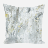 Square pillow with abstract textures in white, gray, and subtle gold accents creating a soft, marbled effect