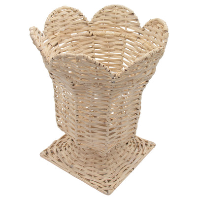 White wicker urn vase in handwoven rattan sitting on a white surface