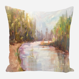 Square pillow featuring a soft impressionist landscape of a river flanked by trees in muted greens, browns, and purples under a pale sky.