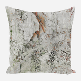 Square pillow with abstract textured pattern in muted gray, beige, and rust tones creating a weathered, painterly effect