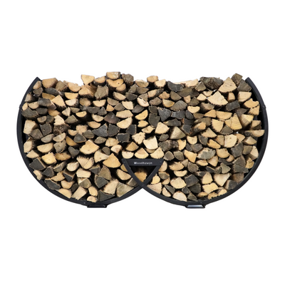 Winter Workman firewood rack by The Woodhaven showing curved steel design and wood storage