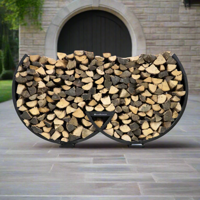 Winter Workman firewood rack by The Woodhaven showing curved steel design and wood storage