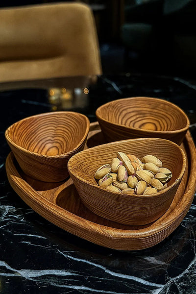 Set of handcrafted wooden nut bowls with tray showing natural wood grain and sandblasted texture