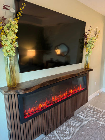 Custom live edge walnut wood mantel shelf above modern fireplace showcasing natural wood grain and handcrafted detail
