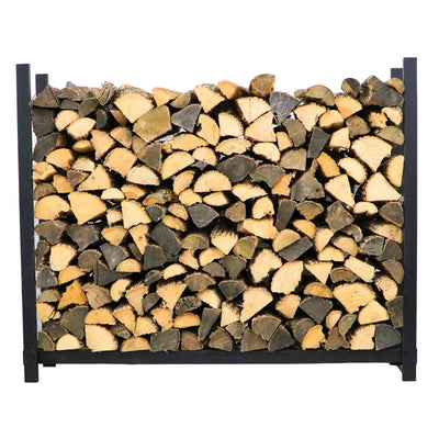 The Woodhaven 5 ft Firewood Rack in black showing stacked firewood on a patio