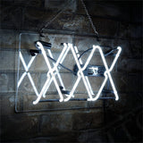 White neon light shaped into three overlapping X's mounted on a transparent rectangular panel against a dark brick wall, hanging by a metal chain.