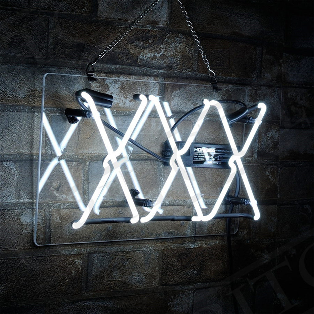 White neon light shaped into three overlapping X's mounted on a transparent rectangular panel against a dark brick wall, hanging by a metal chain.