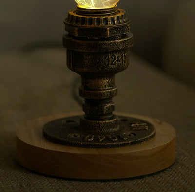 EP Light Spring Resin LED Bulb with green resin design on wooden base