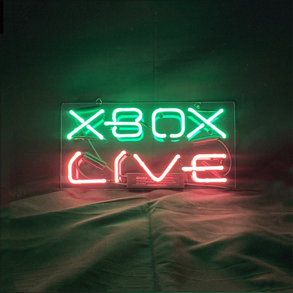 Illuminated Xbox Live Neon Sign with a green glow mounted on a wall