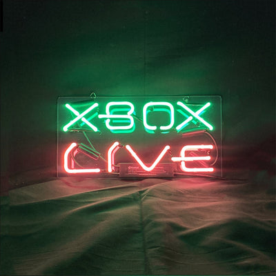 Illuminated Xbox Live Neon Sign with a green glow mounted on a wall