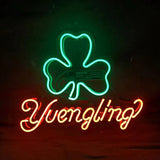 Green neon shamrock outline above red neon cursive 'Yuengling' text against a dark background.
