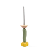 Candlestick featuring a yellow flower-shaped base, a curved green central section resembling a cucumber, and topped with a beige cup holding a tall silver candle.