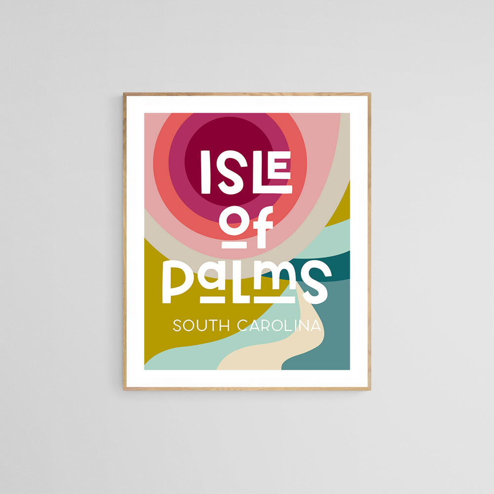 Abstract modern art print with bold concentric circles in red and pink above curving shapes in mustard, teal, and cream featuring the text 'Isle of Palms South Carolina' in stylized white letters.