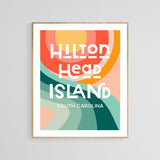 Modern art print featuring abstract concentric circles in warm tones above stylized green and teal wave shapes, with bold white text reading ‘Hilton Head Island South Carolina’.