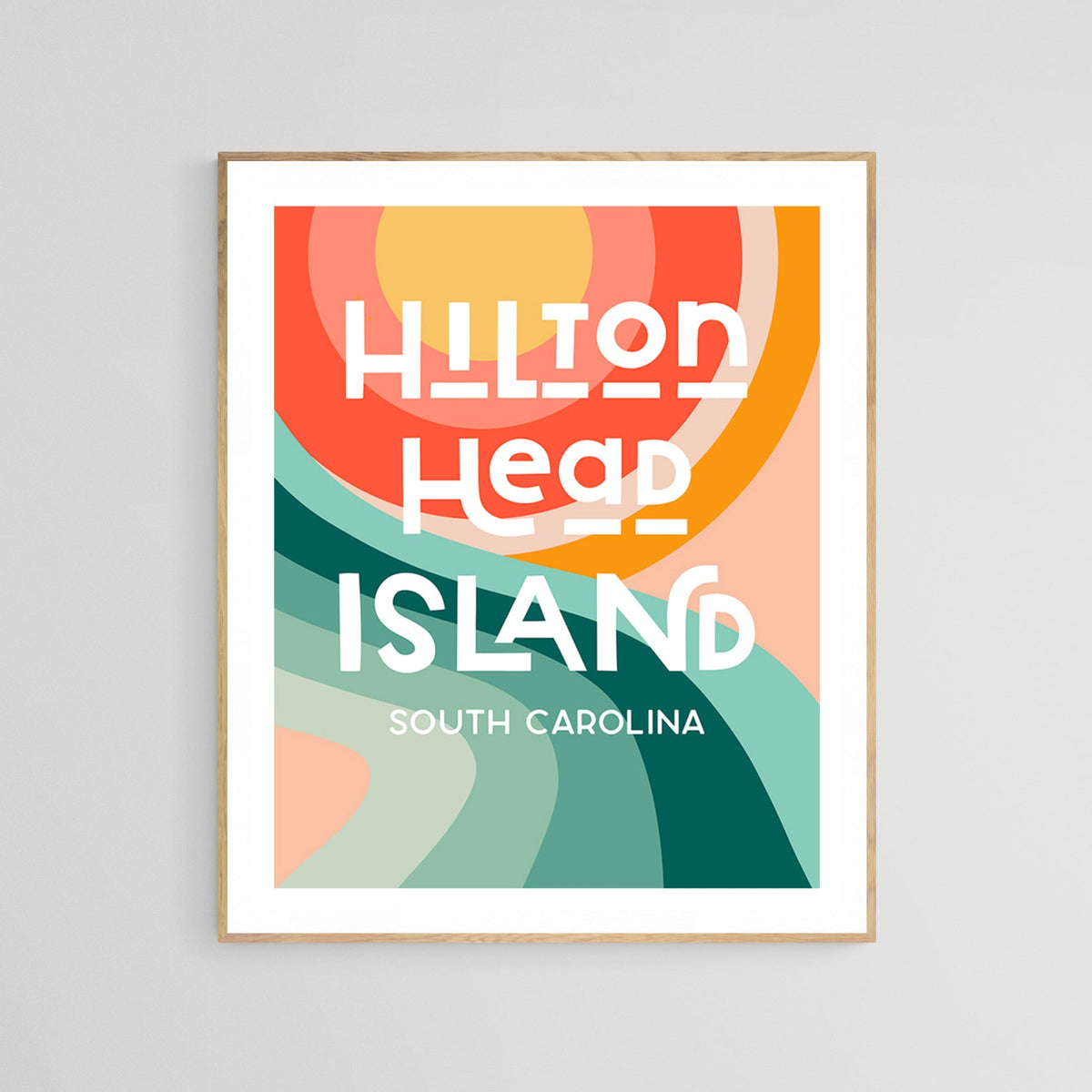 Modern art print featuring abstract concentric circles in warm tones above stylized green and teal wave shapes, with bold white text reading ‘Hilton Head Island South Carolina’.