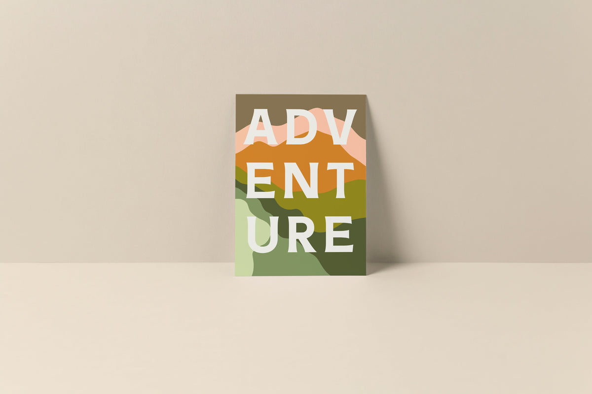 Note card with stylized letters spelling 'ADVENTURE' over an abstract landscape of green, brown, pink, and cream color blocks.