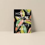 Home Is Where The Plants Are blank notecard featuring green leaves artwork and text