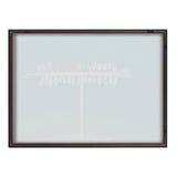 Framed glass print showing a subtle, light blue and white image of a row of weathered wooden posts with circular elements on top against a pale background.