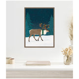 Framed canvas print of a reindeer with colorful Christmas lights tangled in its antlers, walking on snow with dark green pine trees and a starry night sky background.