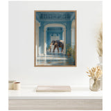 Elephant walking through an ornate hallway painted in shades of blue with arched doorways and intricate ceiling details, framed in a simple wooden frame.