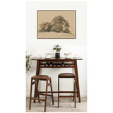 Minimalist room with a dark wood bar table and two stools, featuring a potted plant, white bowls, and a sepia-toned tree print framed on the wall above.