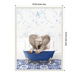 A baby elephant sitting playfully in a deep blue clawfoot bathtub on patterned blue and white tiled floor, with delicate blue floral wallpaper in the background.