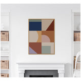 Geometric abstract wall art with rectangles, triangles, and semicircles in navy blue, beige, rust, tan, lavender, and muted green, framed and centered above a white fireplace.
