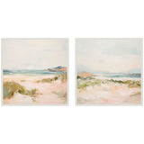 Two square framed canvas prints depicting soft, pastel beach landscapes with sandy dunes, greenery, and distant hills under a pale sky.
