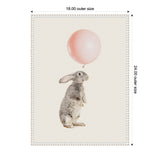 Illustration of a gray and white bunny balancing a light pink balloon on its nose against a cream background in a white beaded frame.