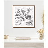 Black line drawing of a cheese platter with tomatoes, sliced pizza, a bowl of salad, a glass of wine, and a plate with a slice, framed in wood on a white wall.