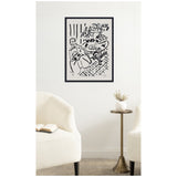 Black and white Henri Matisse line drawing 'Fille assise a table 1947' framed and hung on a white wall above a modern brass side table with a white vase and dried flowers, flanked by two cream armchairs.