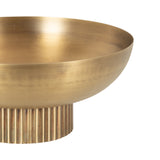 Golden metal bowl with a smooth, rounded edge and a vertically ribbed cylindrical base, shown in close-up against a white background.