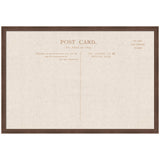 Framed linen fabric pinboard designed like a vintage postcard with sepia-toned printed text and divisions on a beige background.