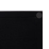 Close-up of a black rectangular tray corner with a circular black pad on the frame for surface protection, showing clean lines and a matte finish.