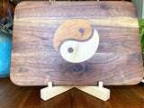 Walnut charcuterie board with Cherry and Maple Yin Yang wood inlay, handcrafted serving board