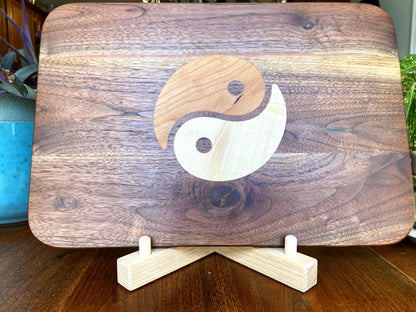 Walnut charcuterie board with Cherry and Maple Yin Yang wood inlay, handcrafted serving board