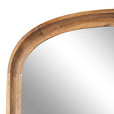 Close-up of a wooden arch-shaped mirror frame with natural grain and warm brown tones, showing smooth rounded corners and a seamless join.