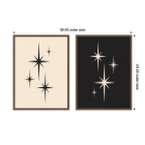 Two framed canvases side by side, one beige with black retro starburst shapes, the other black with beige starburst shapes, each with various sized stars.