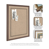 Rectangular pinboard with natural canvas surface bordered by a black scallop pattern and a medium brown wooden frame, shown with two black and white photos pinned.