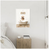 Framed canvas of a golden retriever puppy in a bubble-filled vintage bathtub with a 'Hot Bath $1.00' sign above, displayed on a white wall above a rustic wooden nightstand.