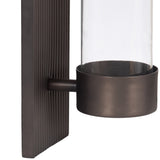 Bronze-colored metal wall sconce with a textured vertical rectangular backplate and a cylindrical clear glass shade extending from a round metal holder.