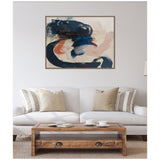 Abstract framed canvas with bold deep blue and coral brushstrokes on neutral background, hanging above beige sofa with striped and solid pillows in minimalist living room.
