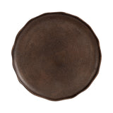 Round decorative tray with a dark brown textured surface and softly scalloped edges, photographed from above on a white background.