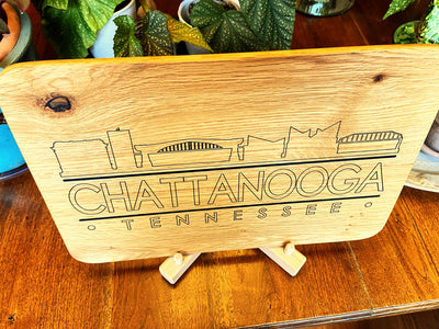 Handmade white oak charcuterie board with engraved Chattanooga skyline