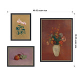 Three framed wall art prints with black decorative frames: a pink cyclamen on tan background, a still life of fruit on lavender, and a bouquet in a white vase on dark reddish background, arranged in a 48x39 inch layout.