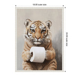 Framed canvas painting of a tiger cub holding a white toilet paper roll against a neutral beige-gray background, measuring 18 by 24 inches.