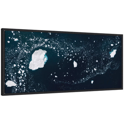 Sylvie Blue and White Iceberg Pattern in Greenland framed canvas art by Michael Schauer, displaying abstract blue and white iceberg shapes on a green background.