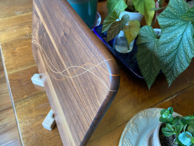 Walnut charcuterie board with Cherry and Maple decorative banding, handcrafted by Fitzgerald Custom Woodcraft