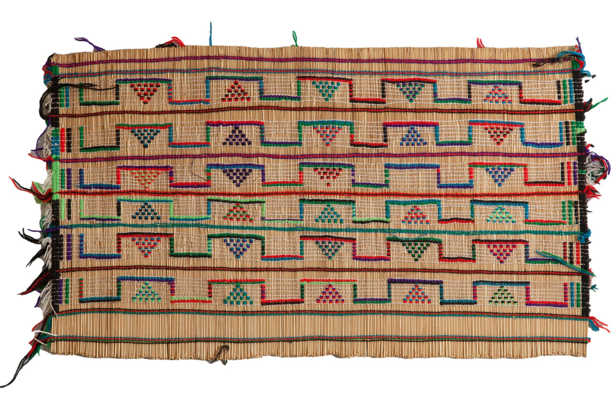 Vintage African Tuareg Rug Mat showing traditional woven straw pattern with tassels