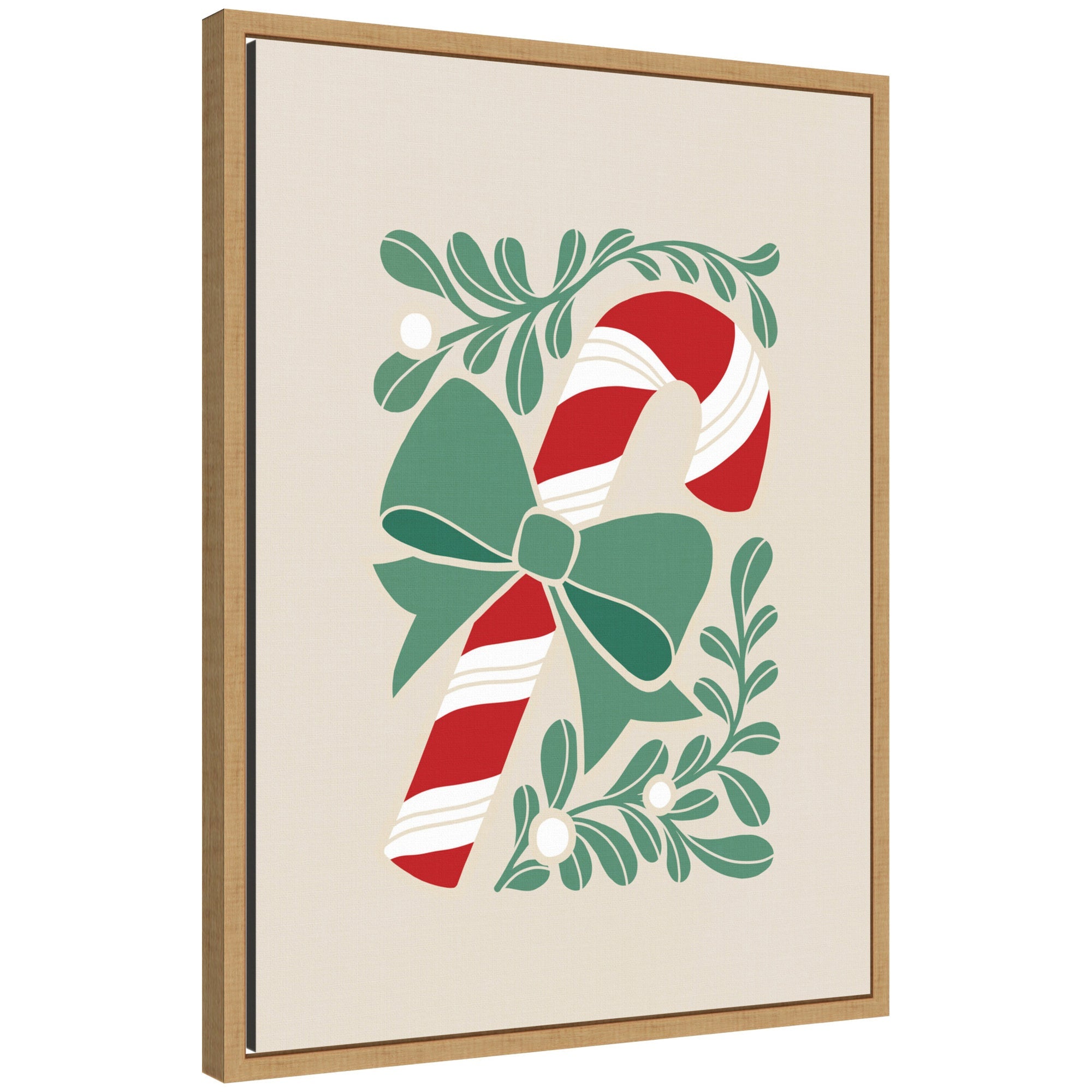Framed canvas art showing a red and white candy cane with a green bow, surrounded by stylized green leaves and mistletoe berries